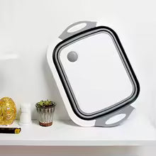 Clarify.pk 2 in 1 Cutting board and foldable wash basin in white and gray on a kitchen shelf