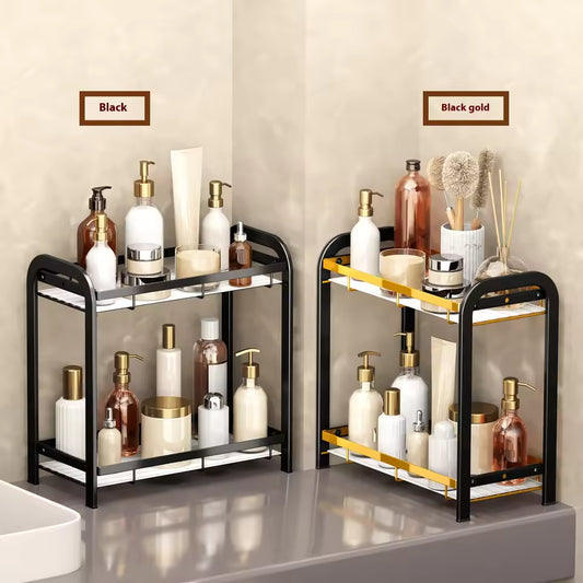 Clarify.pk 2 tier bathroom counter organizer in black and black gold holding toiletries and skincare bottles