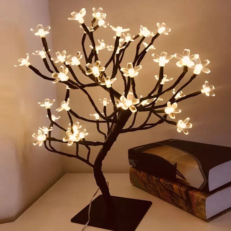 Clarify.pk 24 LED night light table lamp shaped like a flowering tree with warm white lights on a bedside table