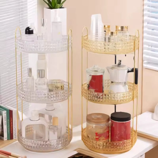 Clear and gold 3 layer cosmetic organizer rack holding bottles and containers on a white tabletop