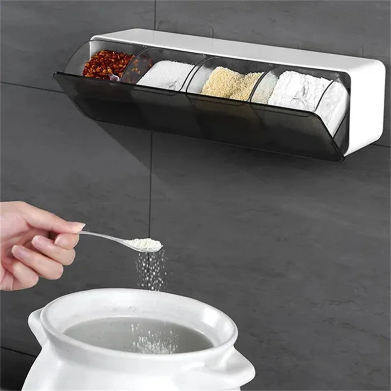 Clarify.pk 4 in 1 spice container organizer mounted on wall with spices and a hand sprinkling spice into pot