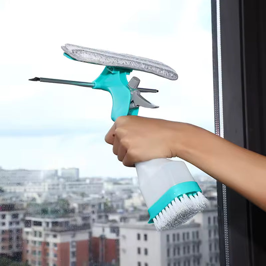 Hand using 4-in-1 window glass cleaner tool with spray bottle and scrubbing brush cleaning a city view window