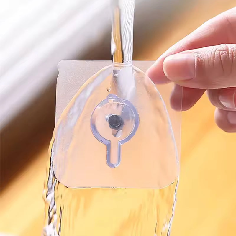 Clear adhesive wall hooks for home by Clarify.pk holding water under running faucet