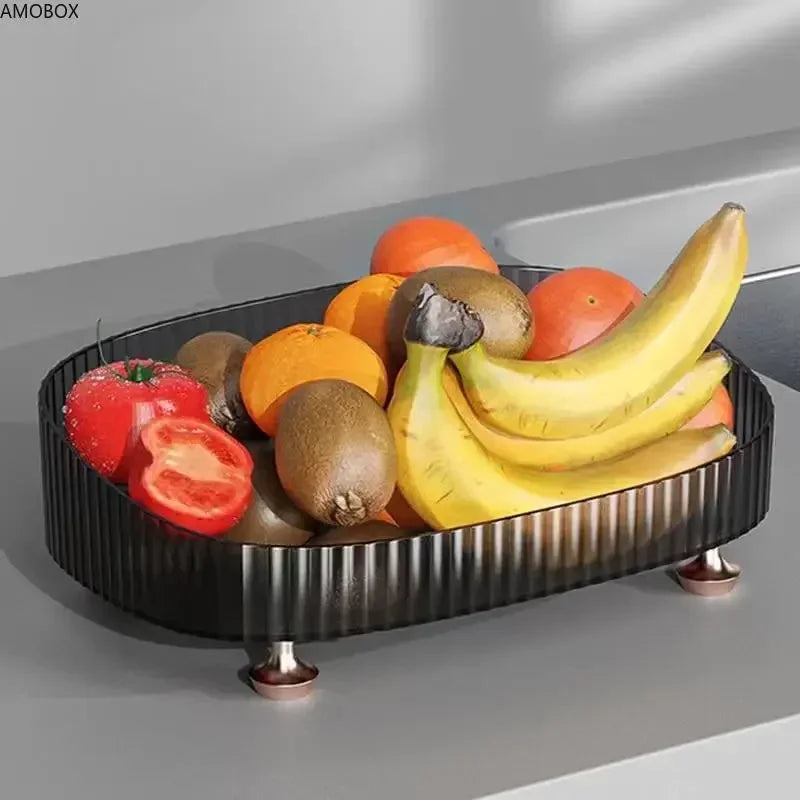 Black transparent dresser storage box holding fresh fruits including bananas, tomatoes, and kiwis
