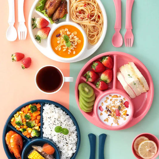 Clarify pk 4 compartment plastic dinner plate in white pink and navy filled with rice vegetables fruit and yogurt