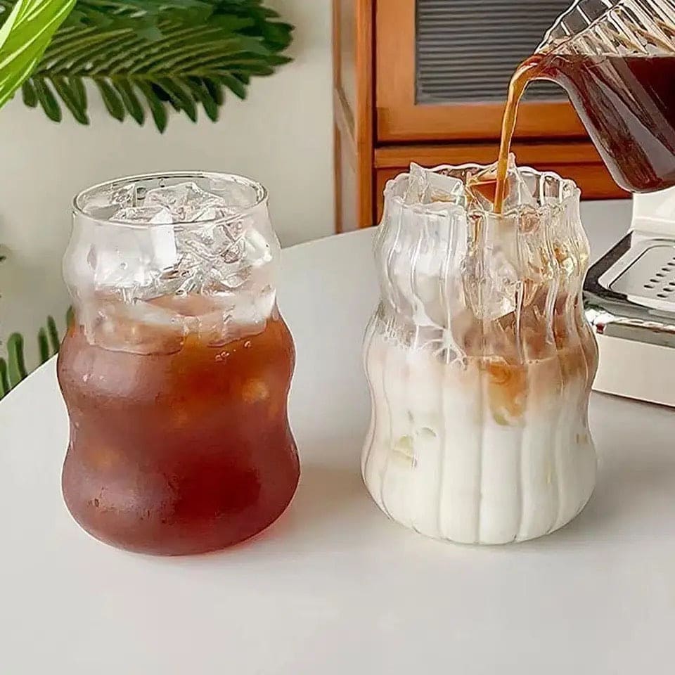 Clear wavy glass mugs with ice and iced coffee, showcasing bamboo lid glass mug with straw by Clarify.pk