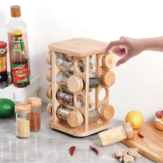 Clarify.pk bamboo spice rack organizer with rotating cylindrical jars storing various spices on kitchen counter
