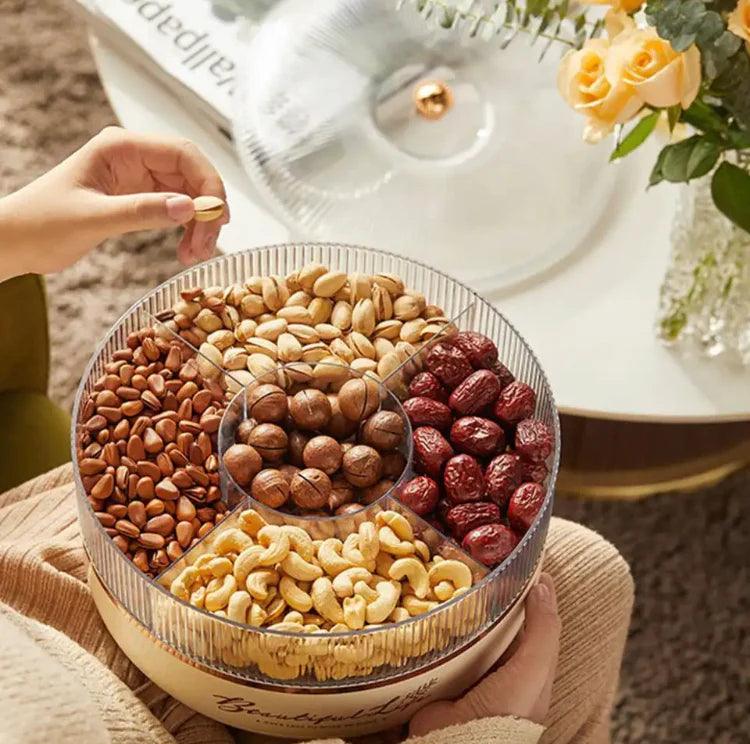 Luxury dry fruit tray with pistachios, cashews, red dates, almonds, and walnuts in a clear container