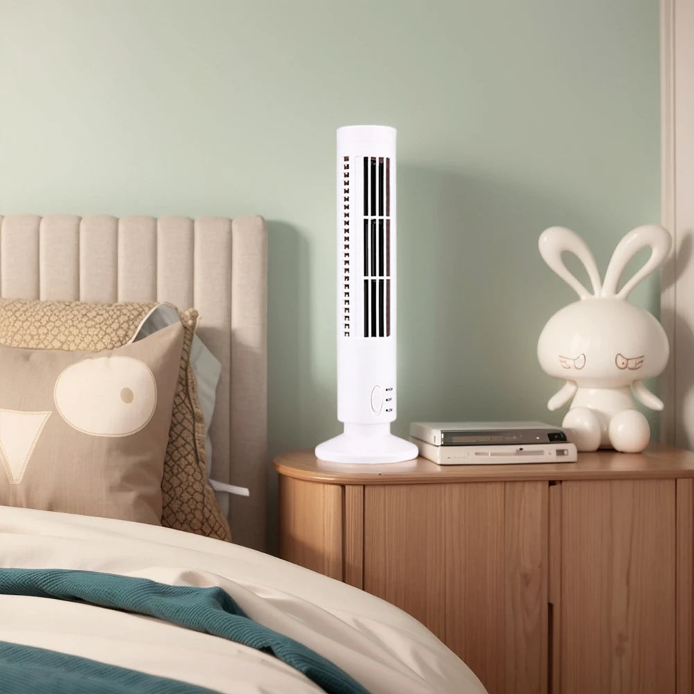 Clarify.pk bladeless desktop tower fan in white placed on wooden bedside table next to bed and decorative items