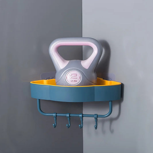 Wall-mounted corner shower shelf in blue and yellow with four hooks holding a 2kg kettlebell