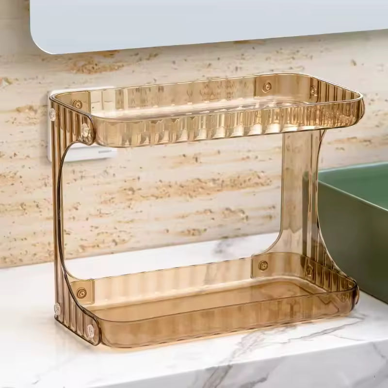 Clarify.pk gold-colored double layer bathroom organizer on marble countertop near sink