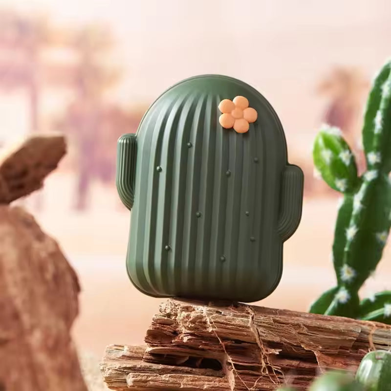 Clarify.pk green cactus shape soap dish holder with a small orange flower decoration on rustic wood