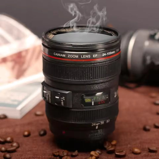 Camera lens coffee mug designed to look like a professional camera lens with steam rising from the hot coffee inside