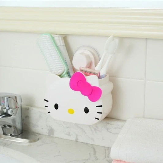 Cartoon bathroom organizer wall mount shaped like a white cat face with a pink bow holding bathroom essentials