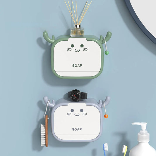 Cartoon soap holder wall mounted in green and gray with cute face design for bathroom organization
