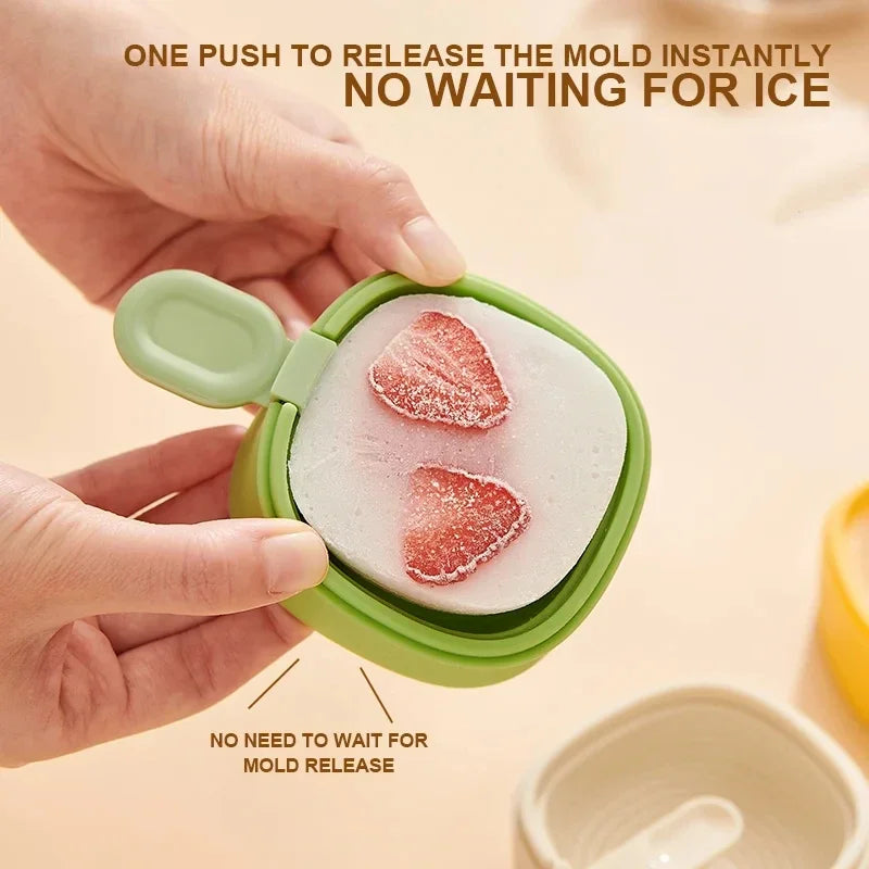 Clarify.pk cat paw ice cream mold pack of 2 in green held open showing strawberry ice cream inside