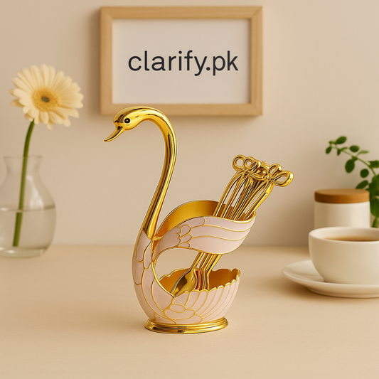 Elegant gold and white swan figurine home decor holding decorative picks on a beige table