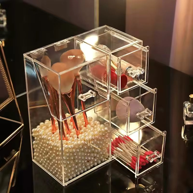 Clear acrylic multi-functional cosmetic organizer with compartments holding makeup brushes, cotton pads, and cotton swabs
