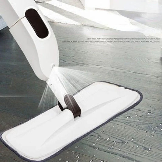 Clarify.pk white spray mop dispensing cleaning solution on a wooden floor with microfiber pad