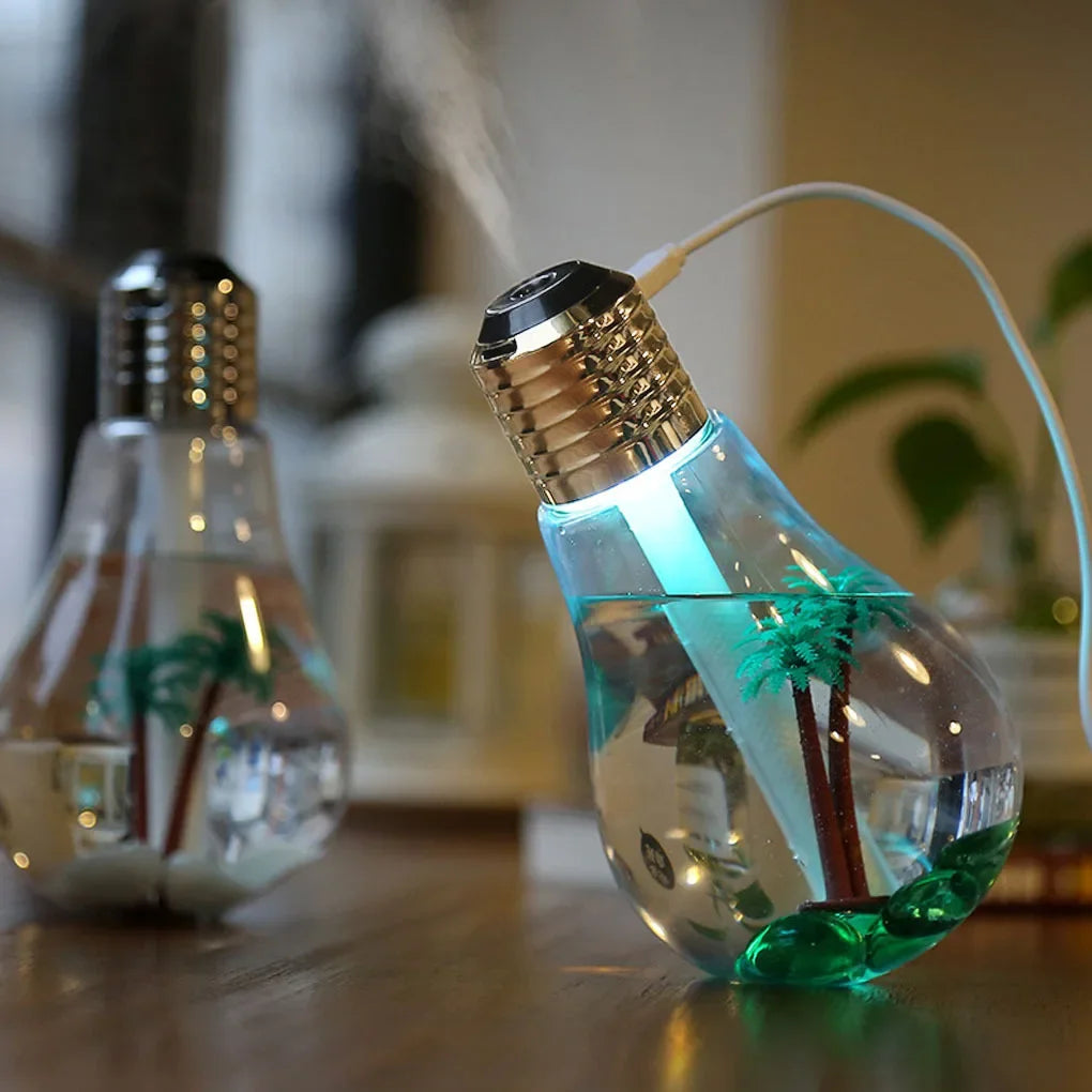 Clarify.pk colorful bulb humidifier with miniature palm trees inside and glowing blue light emitting mist