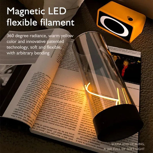 Cordless rechargeable table lamp with magnetic LED flexible filament providing warm yellow light