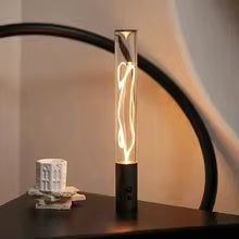 Clarify.pk cordless USB desk lamp with modern design and warm light on a black surface