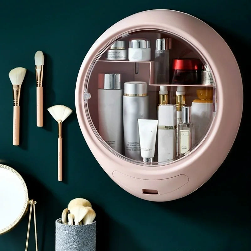 Pink wall-mounted cosmetic storage box filled with various skincare and makeup products on a dark background