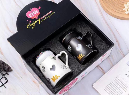 Black and white couple mugs gift set with heart designs labeled Mr. and Ms. in a black gift box