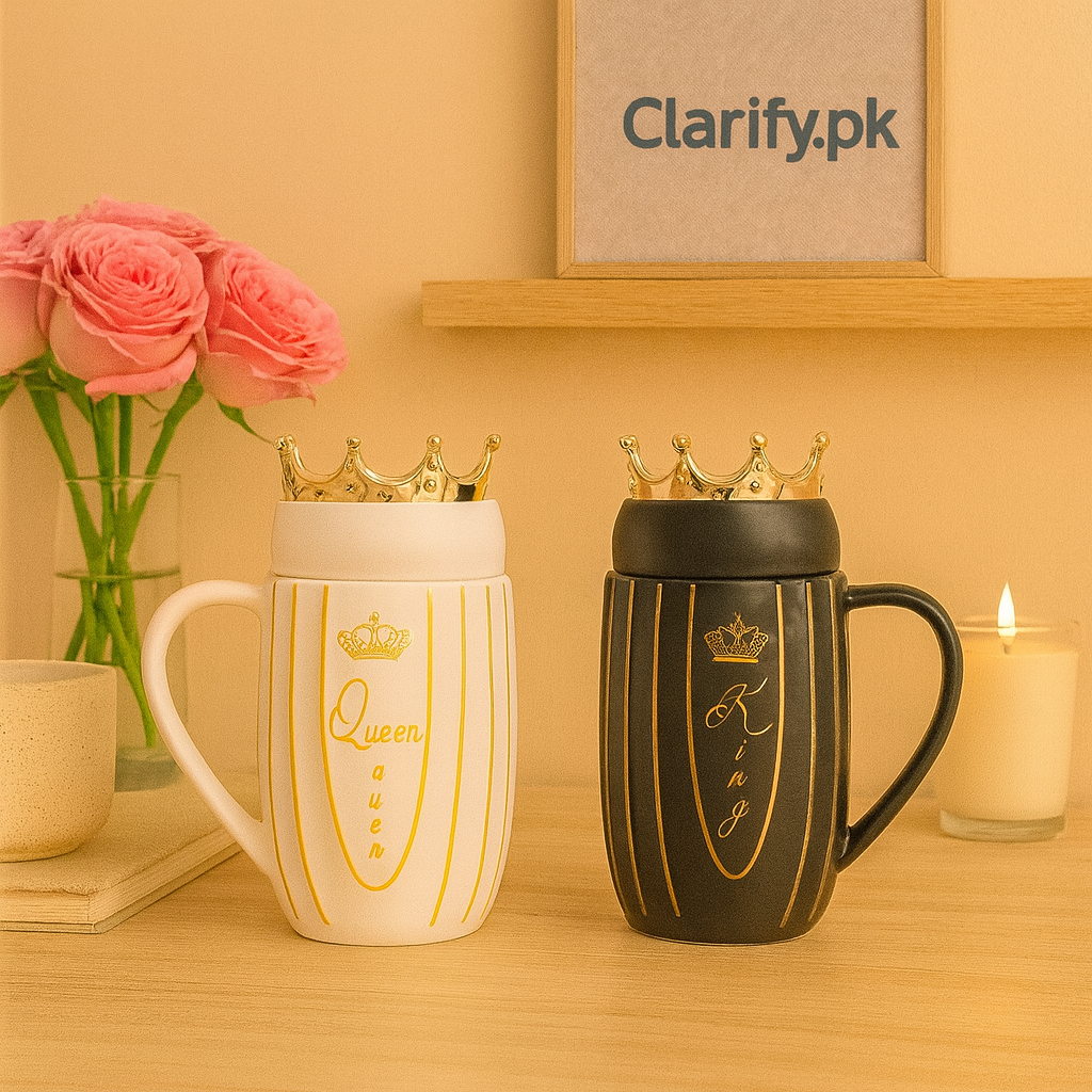 Couple mugs with crowns design featuring a white Queen mug and a black King mug on a wooden table