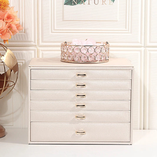 Clarify.pk white 5 layer fashion jewelry storage box with gold handles on a white surface