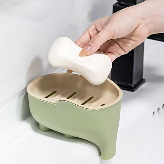 Creative animal soap holder for bathroom in green with a bone-shaped soap being placed on it