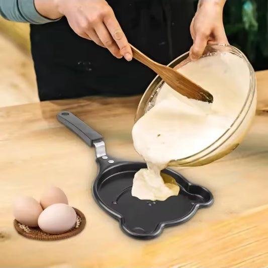 Clarify.pk creative cartoon mini omelette pan with batter being poured for cooking eggs