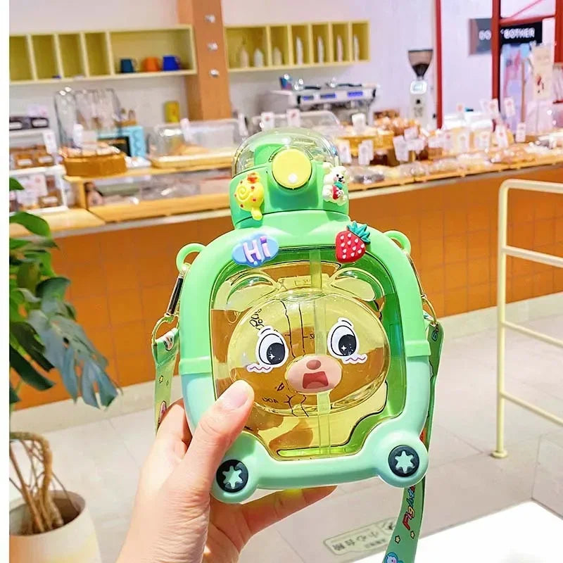 Cute bear water cup for kids in green with cartoon bear face and carrying strap by Clarify.pk