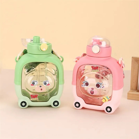 Cute bear water cup for kids in green and pink with cartoon faces and Toy Story branding