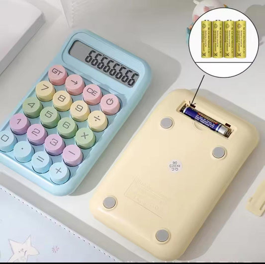 Cute calculator for students with pastel round buttons and battery compartment shown on desk