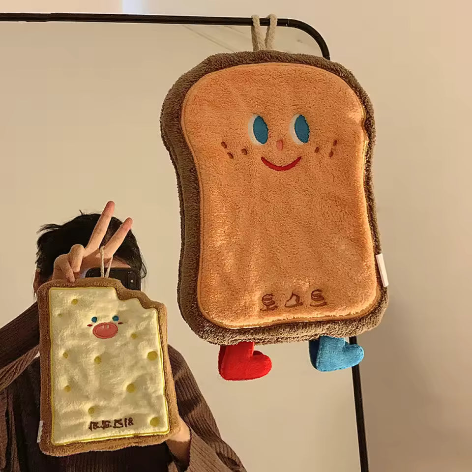 Cute coral velvet hand towels shaped like smiling toast with blue eyes and red and blue feet