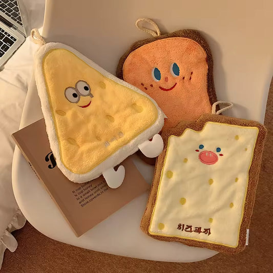 Cute coral velvet hand towels shaped like smiling toast and snack characters by Clarify.pk