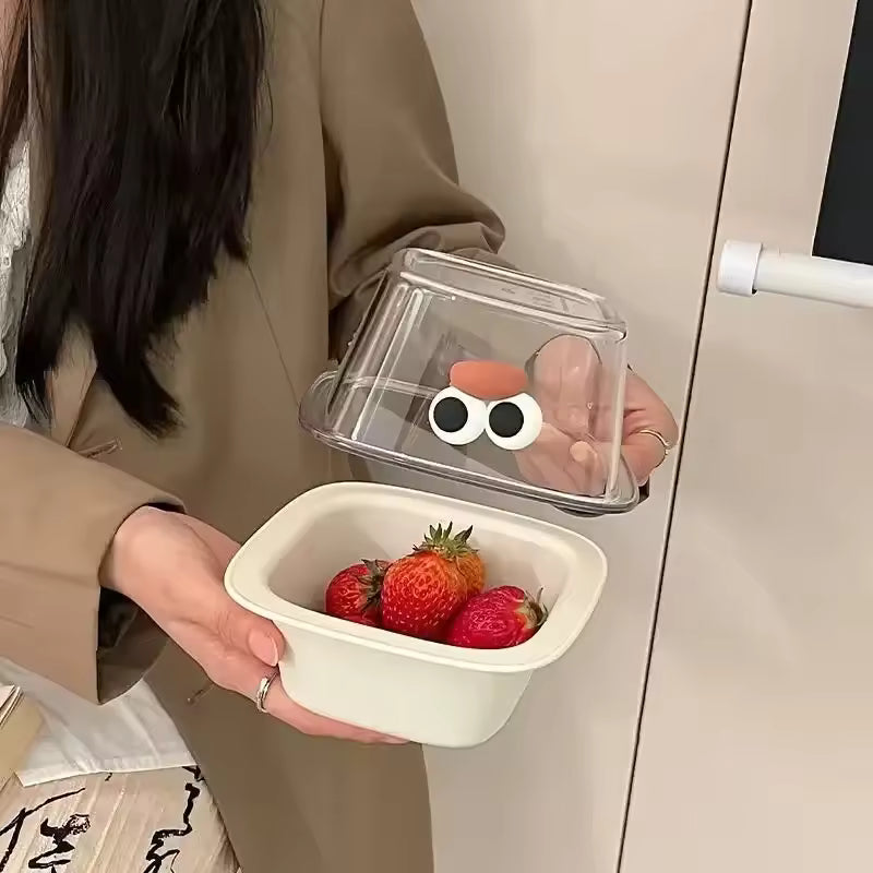 Cute fruit drain basket with a white base and transparent lid holding strawberries