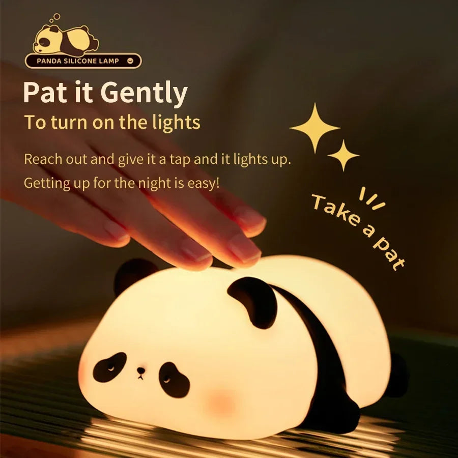 Cute panda desk lamp made of silicone, showing hand patting to turn on soft warm light