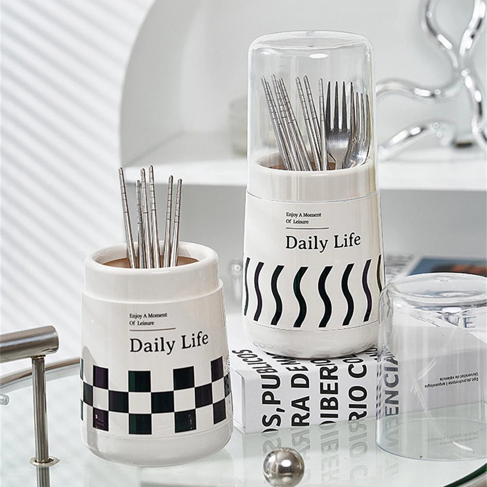 Daily Life kitchen utensil holder with lid in white with black checkered and wave patterns holding cutlery