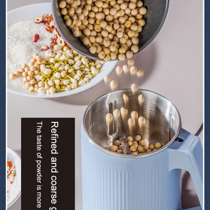 Clarify.pk electric food supplement grinder with soybeans being poured into the stainless steel grinding container