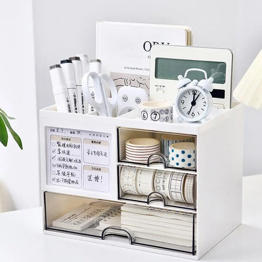Clarify.pk white desktop organizer with drawers holding office supplies like pens, scissors, tape, and clock