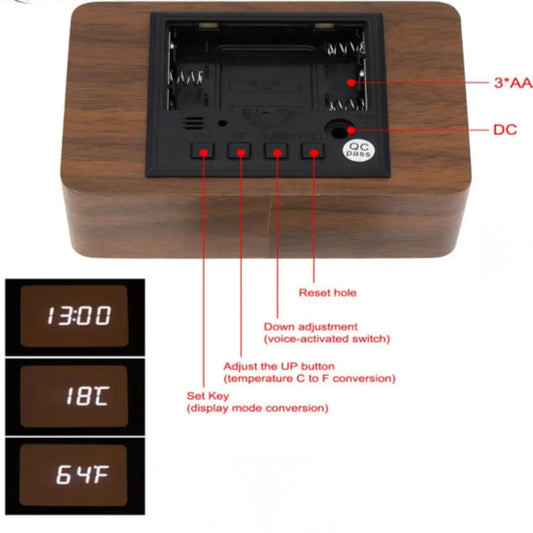 Back view of digital wooden alarm clock showing battery compartment and control buttons for time and temperature settings