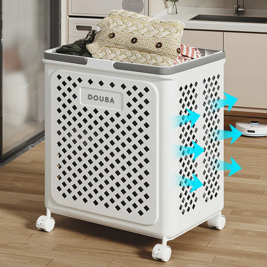 White folding clothes storage basket with ventilation holes and wheels filled with folded clothes