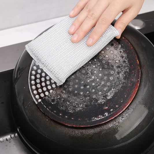 Clarify.pk double sided kitchen cleaning sponge pack of 4 wiping stubborn stains on a pot bottom