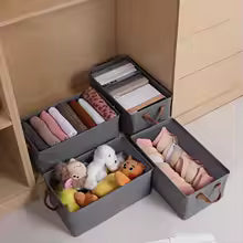 Drawer organizer for closet in gray holding clothes, toys, and accessories to keep items neatly arranged