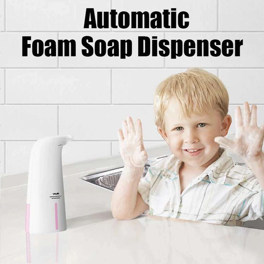 Clarify.pk automatic foam soap dispenser next to smiling child with foam-covered hands in kitchen