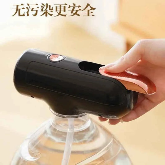 Black electric water bottle pump being operated by hand for easy water dispensing