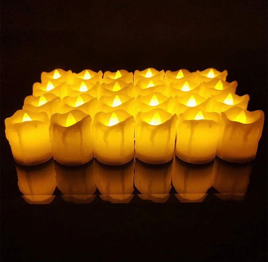 Clarify.pk flameless LED tea lights set glowing warmly in dark with realistic flickering flame effect