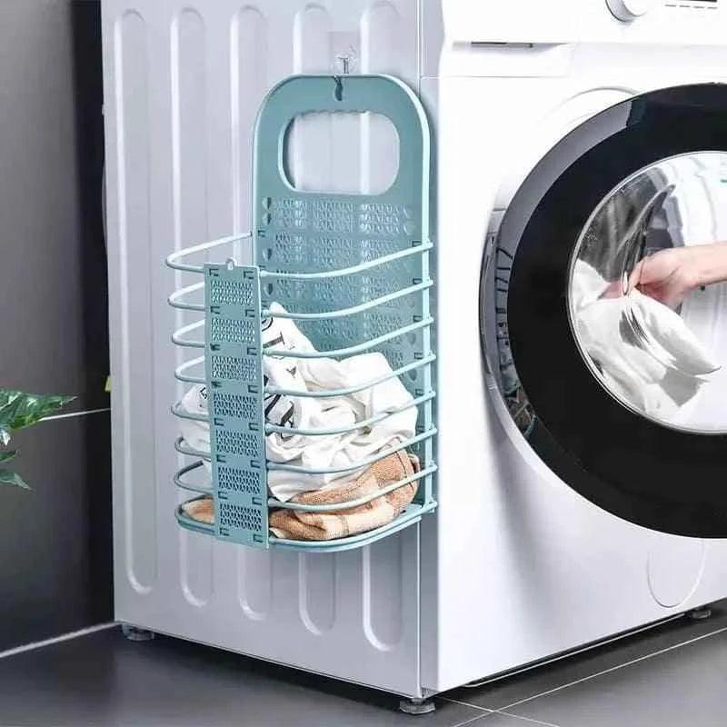 Clarify.pk foldable laundry basket hanging on washing machine filled with clothes
